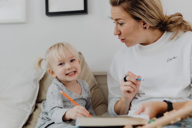 Creating checklist with toddler on paper